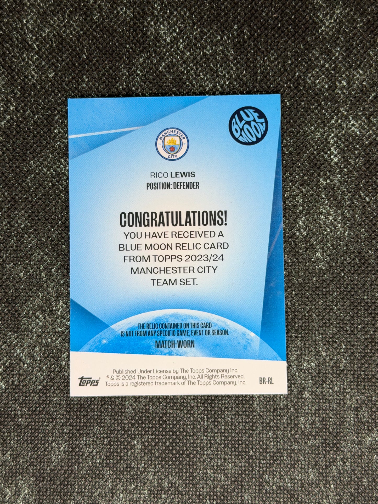 2023-24 Topps Manchester City Team Set Blue Moon Relic Card - Rico Lewis
