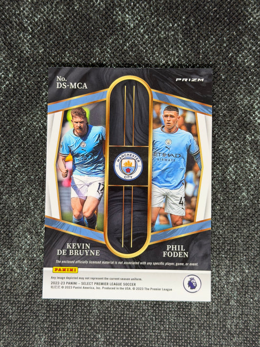 2022-23 Panini Select Premier League Soccer Dual Swatches Silver Prizm - Phil Foden & Kevin De Bruyne