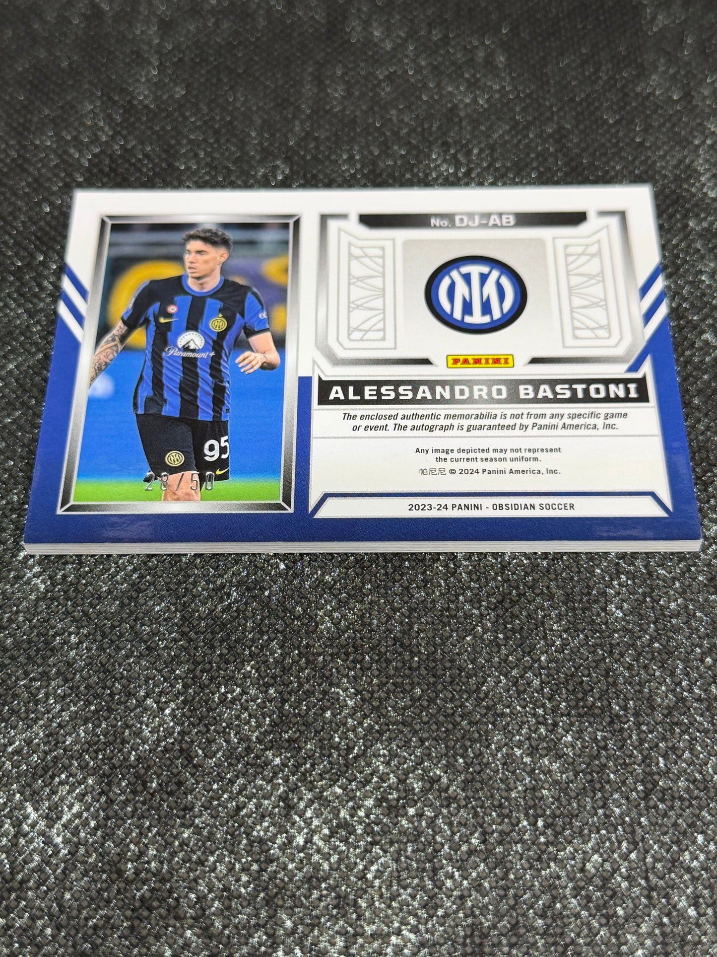 2023-24 Panini Obsidian Soccer Volcanic Dual Jersey Ink 28/50 - Alessandro Bastoni