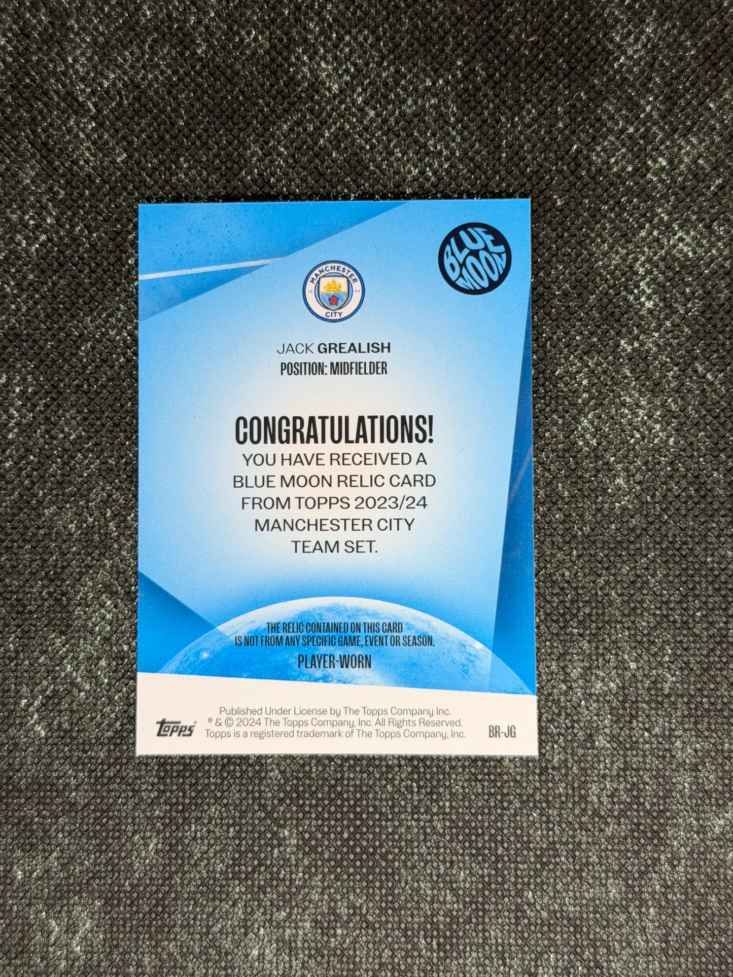 2023-24 Topps Manchester City Team Set Blue Moon Relic Card - Jack Grealish