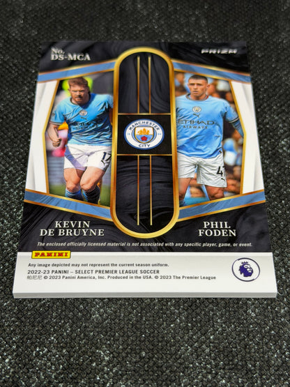 2022-23 Panini Select Premier League Soccer Dual Swatches Silver Prizm - Phil Foden & Kevin De Bruyne
