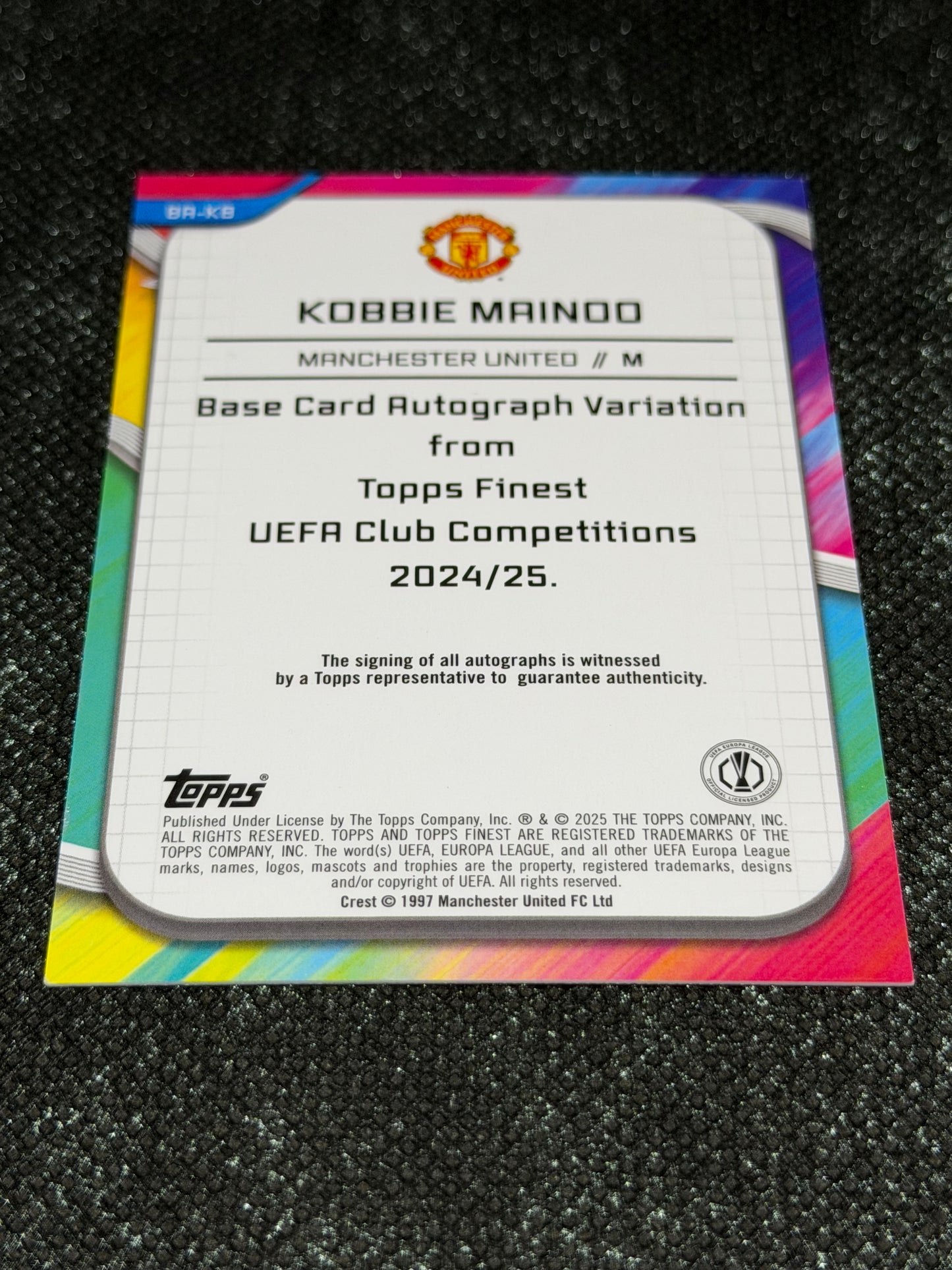 2024-25 Topps Finest UEFA Club Competitions Base Card Autograph Variation Green 83/99 - Kobbie Mainoo