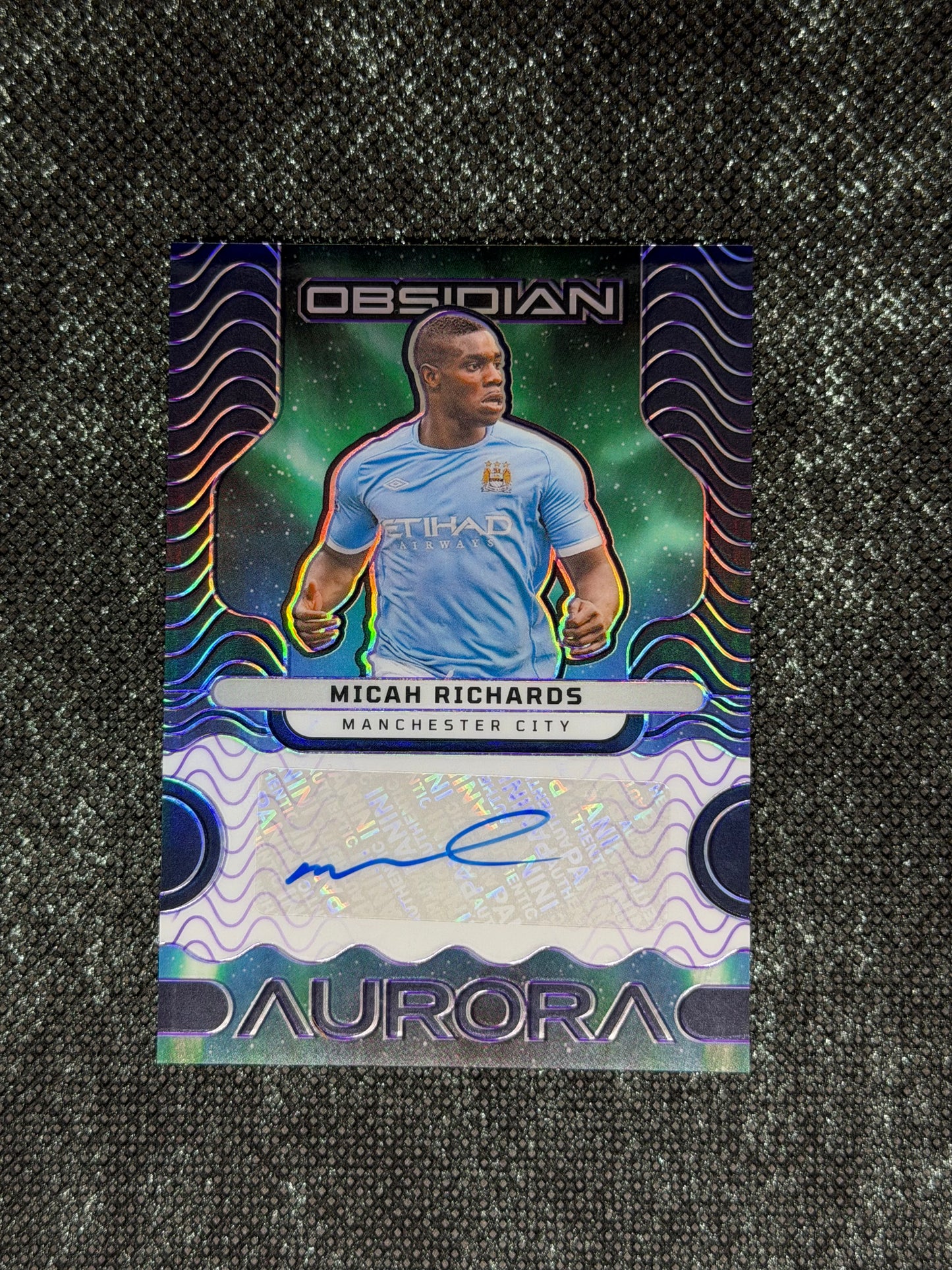 2023-24 Panini Obsidian Soccer Aurora Autographs 40/49 - Micah Richards