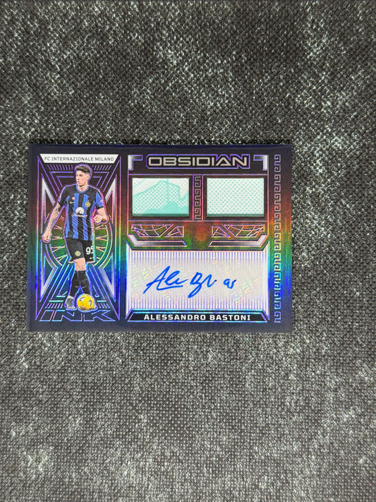 2023-24 Panini Obsidian Soccer Volcanic Dual Jersey Ink 28/50 - Alessandro Bastoni