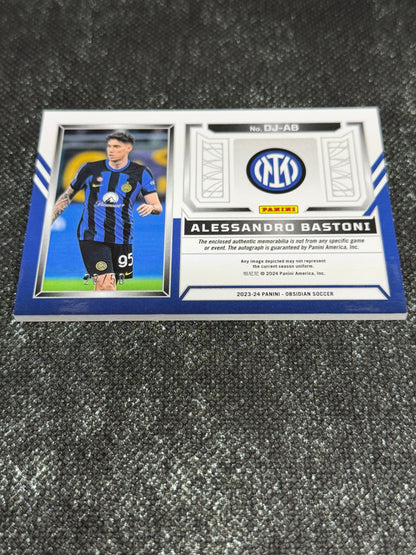 2023-24 Panini Obsidian Soccer Volcanic Dual Jersey Ink 28/50 - Alessandro Bastoni