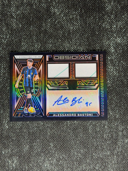 2023-24 Panini Obsidian Soccer Volcanic Dual Jersey Ink 04/99 - Alessandro Bastoni