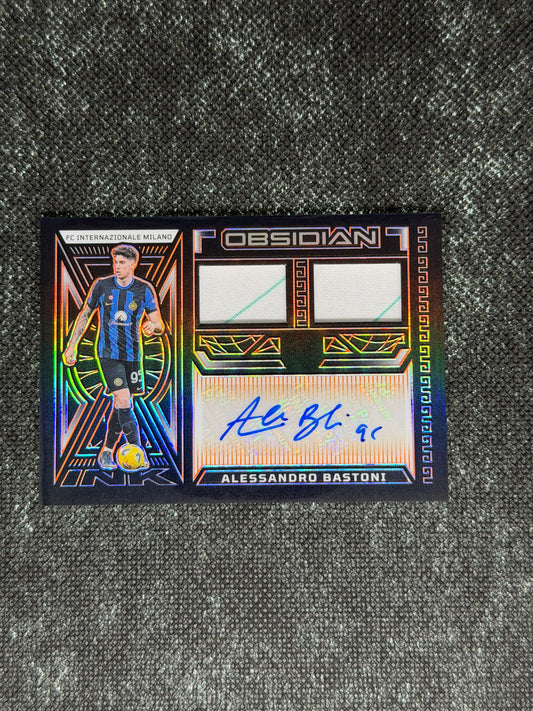 2023-24 Panini Obsidian Soccer Volcanic Dual Jersey Ink 04/99 - Alessandro Bastoni