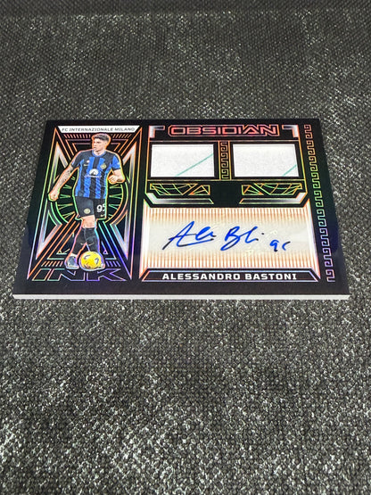 2023-24 Panini Obsidian Soccer Volcanic Dual Jersey Ink 04/99 - Alessandro Bastoni