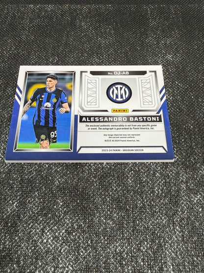 2023-24 Panini Obsidian Soccer Volcanic Dual Jersey Ink 04/99 - Alessandro Bastoni