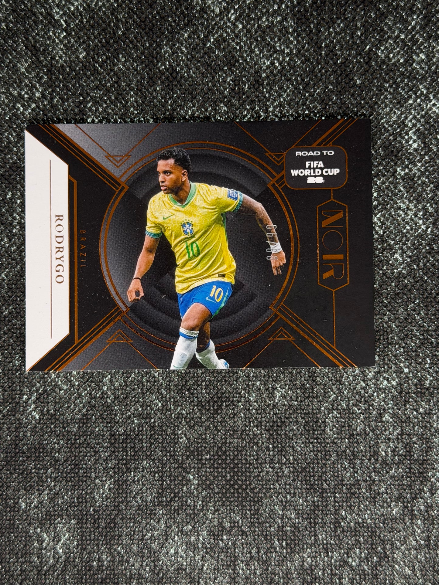 2025-26 Panini Noir Road To FIFA World Cup 26 Soccer Bronze 09/99 - Rodrygo
