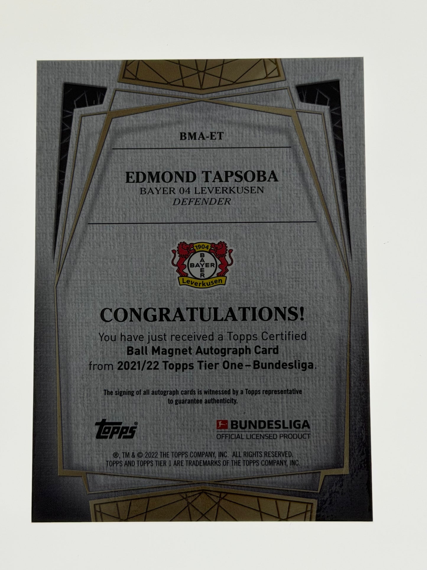 2021-22 Topps Tier One - Bundesliga Ball Magnet Autograph 070/100 - Edmond Tapsoba